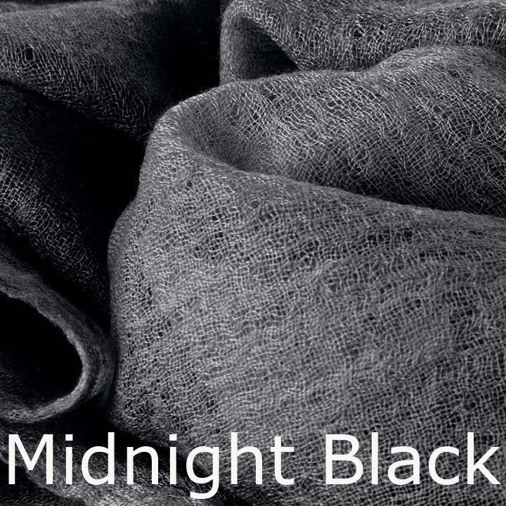 Featherlight and felted black cashmere scarf collection.