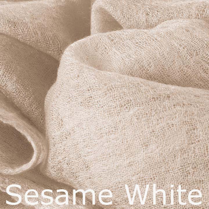 Featherlight and felted white cashmere scarf collection.