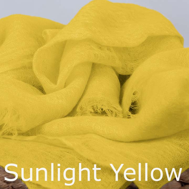Featherlight and felted yellow cashmere scarf collection.