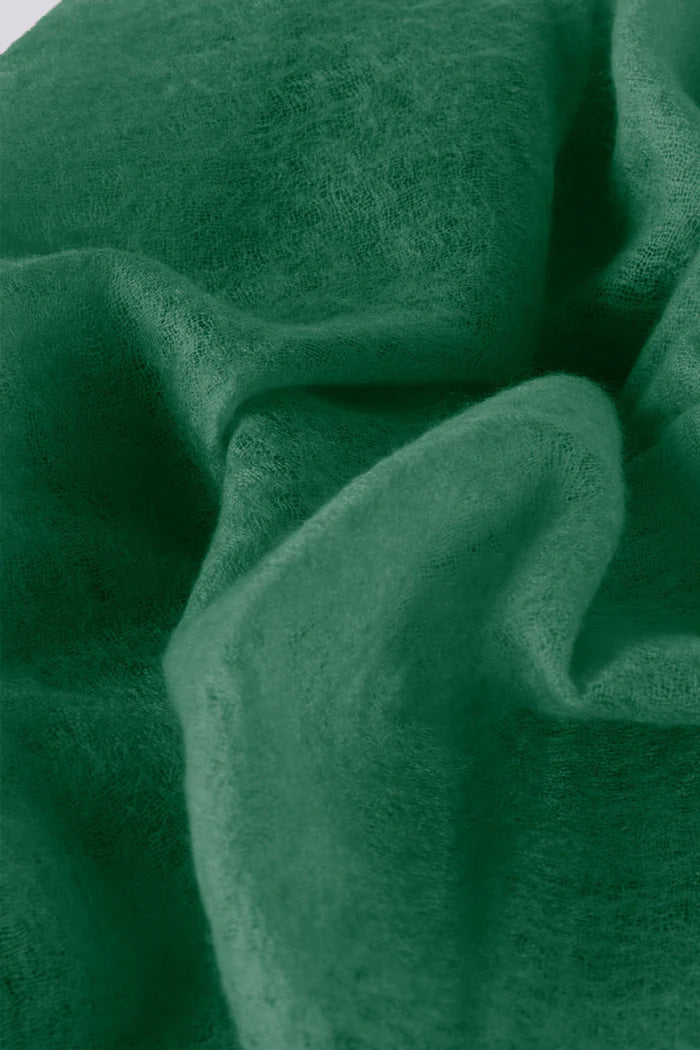 Close-up view of the all seasons forest green cashmere scarf.